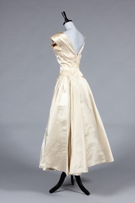 Lot 337 - An Ernest Newman champagne silk and lace...