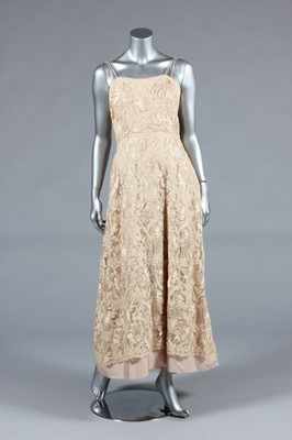 Lot 337 - An Ernest Newman champagne silk and lace...
