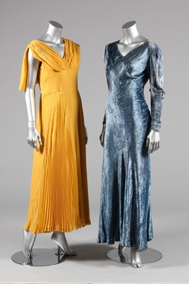 Lot 52 - A gold and ivory lame court gown, circa 1936,...