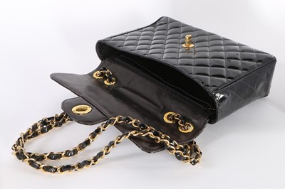 Lot 16 - A Chanel patent leather jumbo flap bag,...