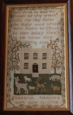 Lot 544 - An embroidered house sampler by Elizabeth...