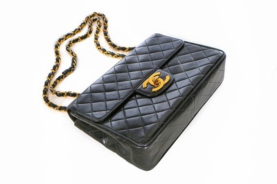 Lot 17 - A Chanel quilted leather jumbo flap bag, late...
