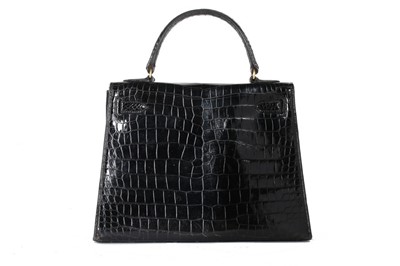 Lot 57 - An Hermès black crocodile Kelly bag, 1950s,...