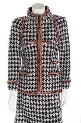 Lot 45 - A Chanel houndstooth checked wool-blend suit,...
