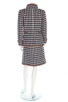 Lot 45 - A Chanel houndstooth checked wool-blend suit,...