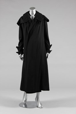 Lot 428 - A Paquin couture black facecloth coat, dated...