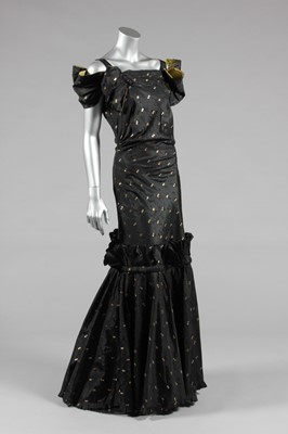 Lot 437 - A black and gold sprigged silk taffeta evening...