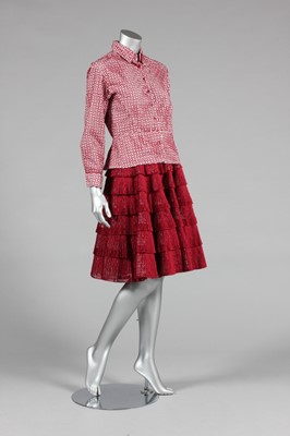 Lot 454 - An Alaia laser-cut wine silk ensemble,...