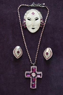 Lot 465 - A Butler and Wilson art-deco face brooch, 1989,...