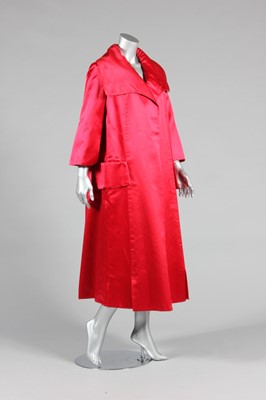 Lot 476 - A deep red satin evening coat, probably 1970s ...