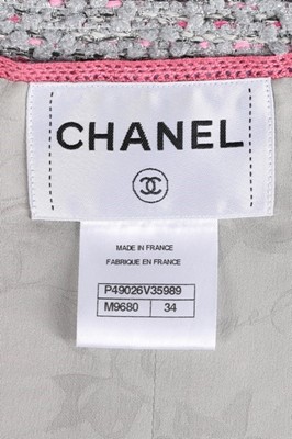 Lot 46 - A Chanel three-piece silver tweed ensemble,...