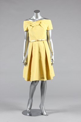 Lot 443 - A Christian Dior yellow silk cocktail dress,...