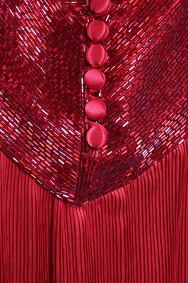Lot 73 - A Yuki red pleated evening gown, probably...