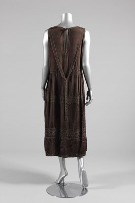 Lot 21 - A beaded brown silk crepe de chine cocktail...