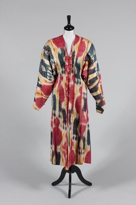 Lot 22 - An ikat silk chapan, circa 1900, woven in...