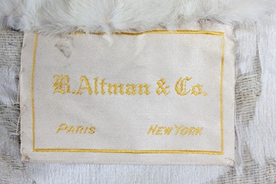 Lot 44 - An R. Altmann & Co black velvet opera coat,...