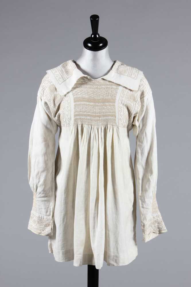 Lot 49 - An embroidered farmer's smock, circa 1900,...