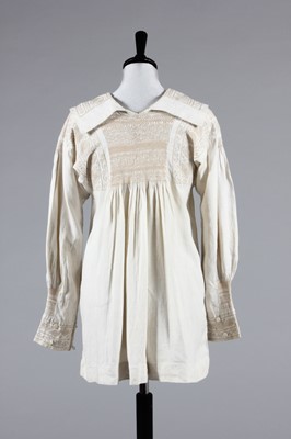 Lot 49 - An embroidered farmer's smock, circa 1900,...