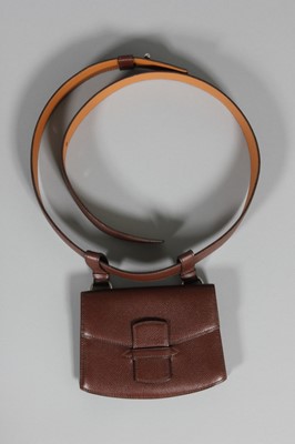 Lot 69 - An Hermès brown leather belt with pouch,...