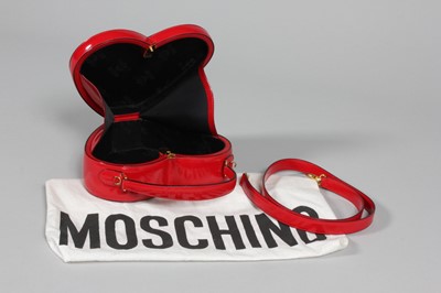 Lot 70 - A Moschino red leather heart bag, probably...