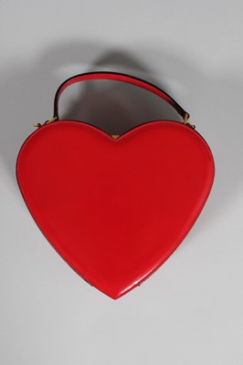 Lot 70 - A Moschino red leather heart bag, probably...