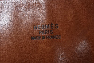 Lot 72 - An Hermès Bolide travel bag, of canvas and tan...