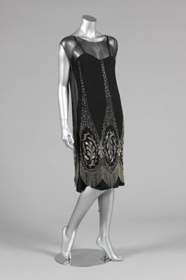 Lot 1 - A black beaded chiffon flapper dress, circa...