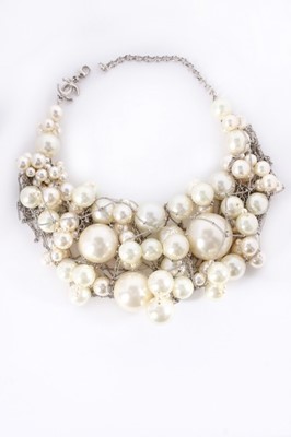 Lot 19 - A Chanel faux pearl and 14ct white gold chain...