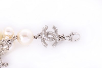 Lot 19 - A Chanel faux pearl and 14ct white gold chain...