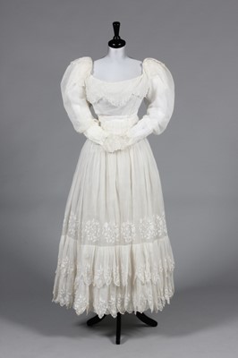 Lot 237 - An embroidered muslin summer dress, late 1820s-...