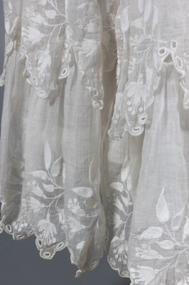 Lot 237 - An embroidered muslin summer dress, late 1820s-...
