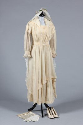 Lot 247 - An ivory charmeuse bridal gown, circa 1918,...