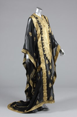 Lot 258 - A lavishly embroidered black chiffon kaftan,...