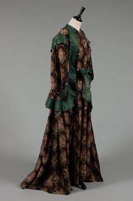 Lot 270 - An unusual printed silk maternity gown, mid...