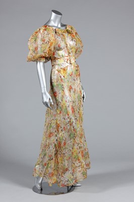 Lot 271 - A floral printed organdy garden party gown,...