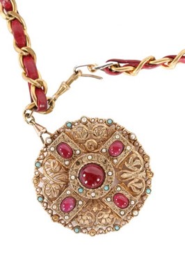 Lot 8 - A Chanel belt with jewelled medallion pendant,...
