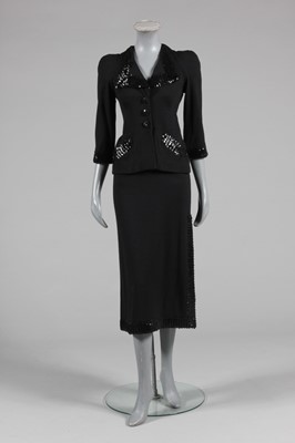 Lot 290 - A Biba sequined black jersey evening suit,...