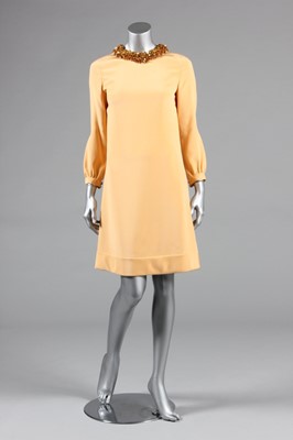 Lot 309 - A Pierre Cardin boutique apricot silk dress,...