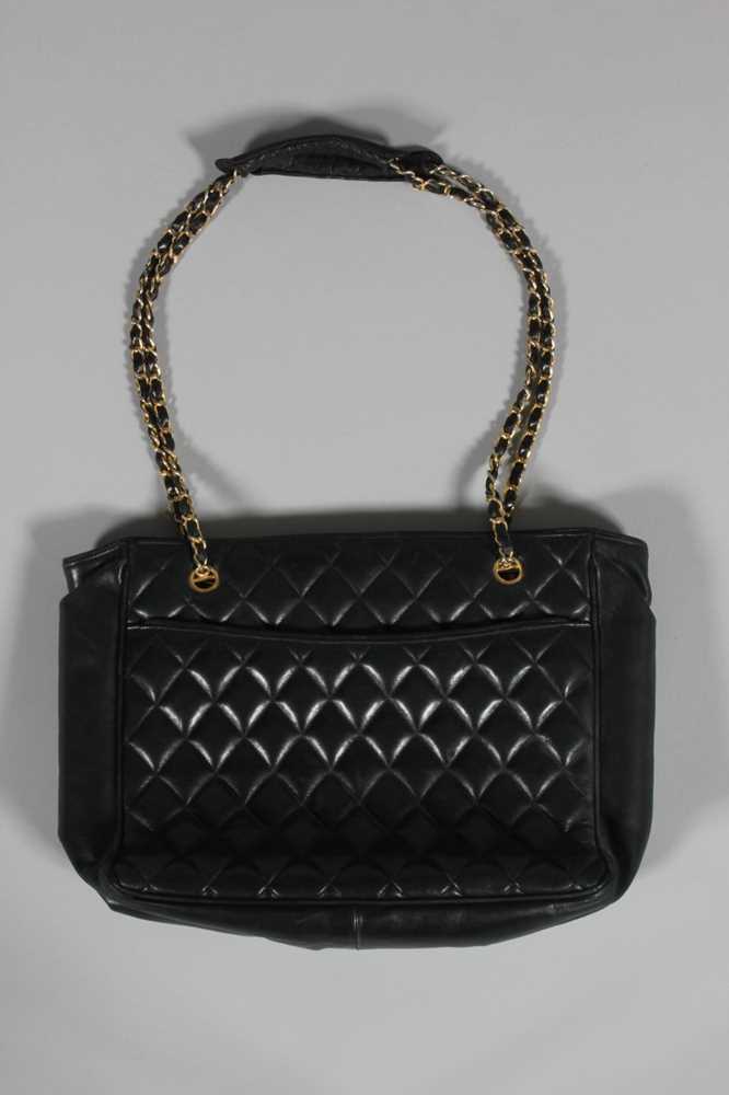 Lot 312 - A Chanel quilted black leather shopper, 1980s,...