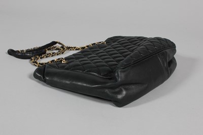 Lot 312 - A Chanel quilted black leather shopper, 1980s,...