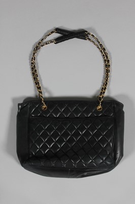 Lot 312 - A Chanel quilted black leather shopper, 1980s,...