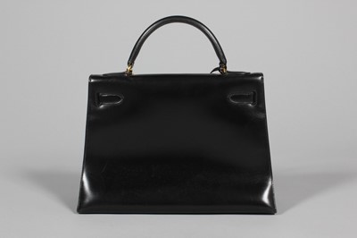 Lot 46 - An Hermès black box calf leather Kelly bag,...
