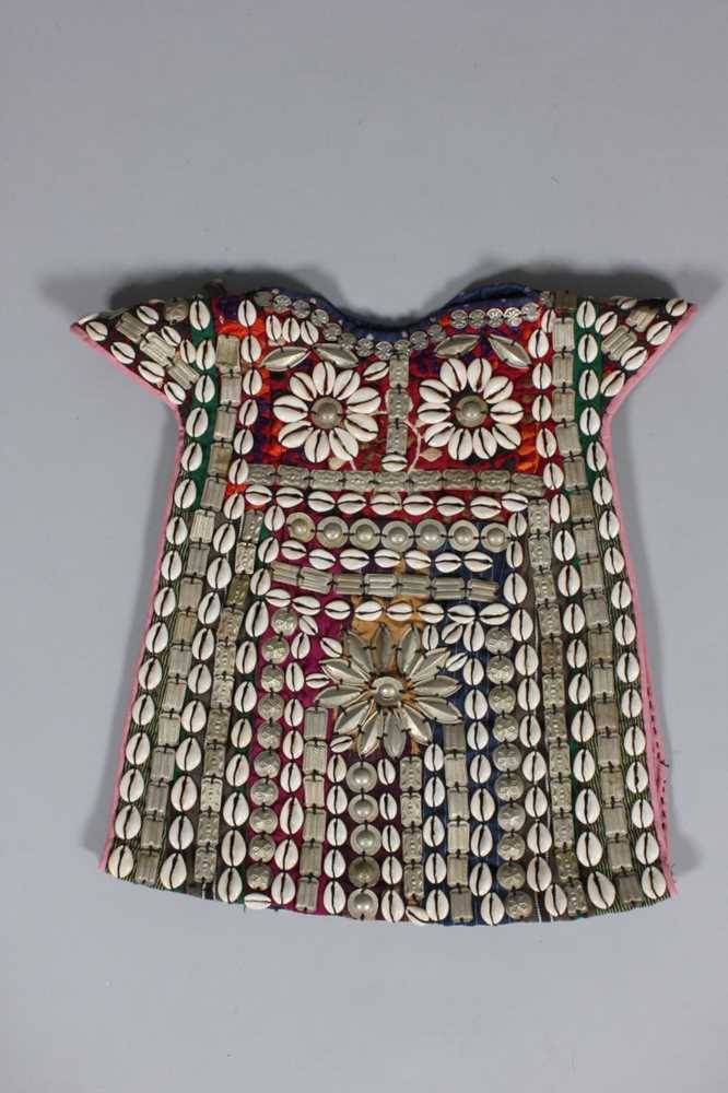 Lot 384 - A Turkmen elaborately adorned ceremonial tunic,...