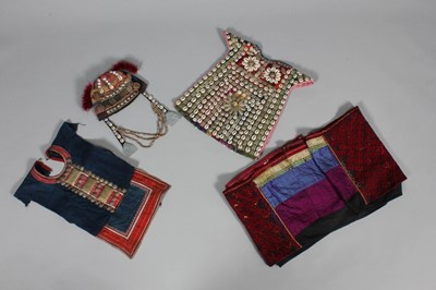 Lot 384 - A Turkmen elaborately adorned ceremonial tunic,...