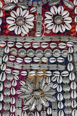 Lot 384 - A Turkmen elaborately adorned ceremonial tunic,...