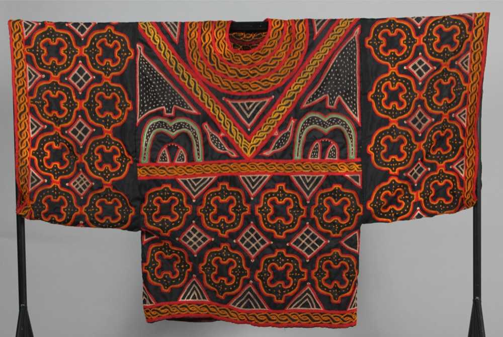 Lot 391 - A brightly embroidered kaftan, West African,...