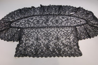 Lot 425 - Two black silk Maltese bobbin lace capelets,...