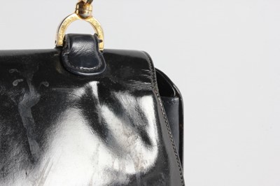 Lot 2 - A Gucci black patent leather handbag with cane...