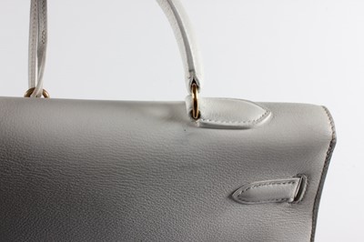 Lot 24 - An Hermès white leather Kelly bag, 1988, blind...