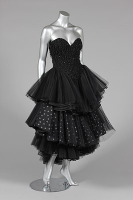 Lot 19 - A black tulle and beaded cocktail dress, 1980s,...